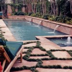 pool with scuppers and flagstone mondo grass decking